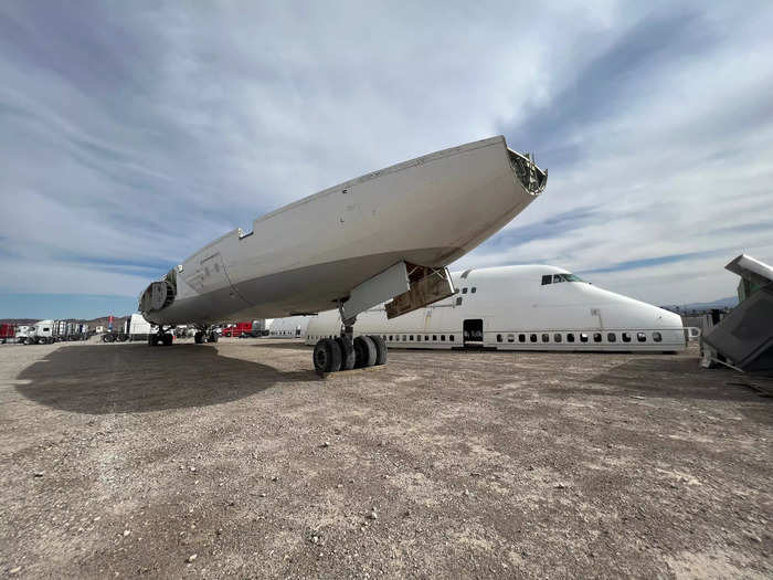 The base of the fuselage was sitting on landing gear to the right of the first two pieces. Cargo was once stored in the belly of the section.