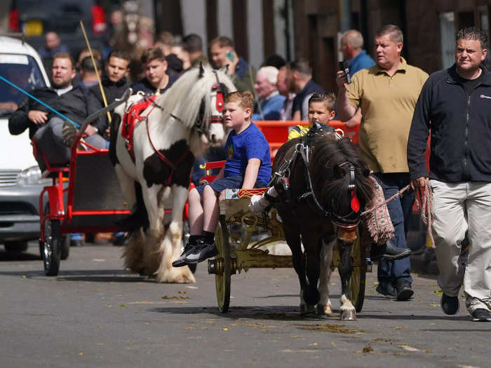 The small town is transformed by hundreds of horse-drawn vehicles