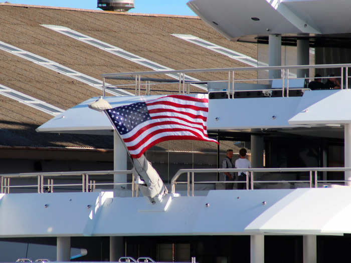 A $300 million Russian superyacht that the US has been attempting to seize since April arrived in Hawaii on Thursday flying the American flag.