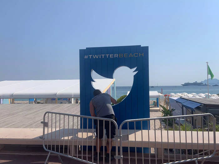 Putting final touches on Twitter beach on Saturday, June 18.