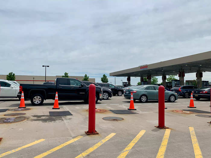 In my experience, Costco is good at managing this traffic. Cones and painted lanes organize customers into orderly lines at each pump.