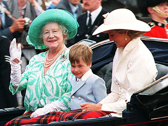 1987: William was exposed to royal life from an early age. In this photo, he shares a carriage ride with the Queen Mother at a parade at Buckingham Palace on June 13.