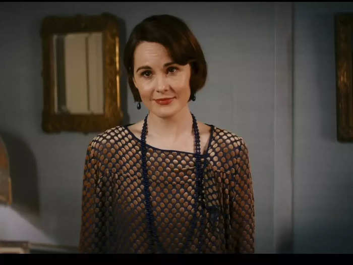 Lady Mary Talbot (née Crawley) is the future of the Downton Abbey dynasty. She has short hair with subtle waves. She adds a small bit of flair to her looks with beads and patterns.