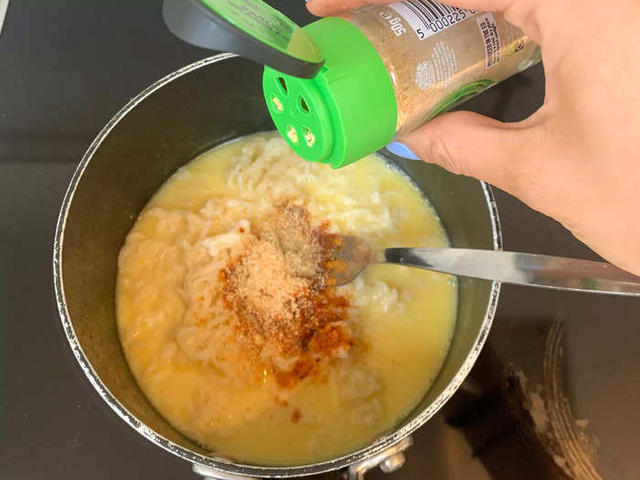 To add color to the dish, I poured in the instant-ramen flavor packet along with garlic powder.