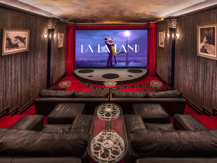 The 10-seater home theater has a 14-foot screen and walls lined with Egyptian silk, Dunn said.