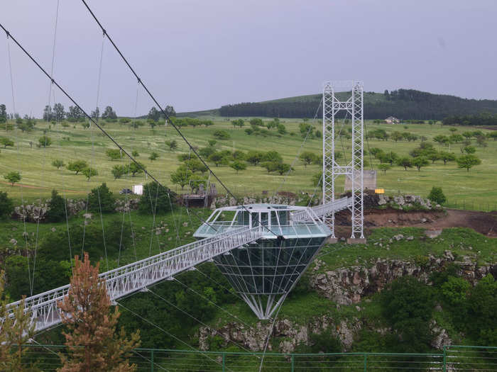 The bar sits in the middle of a glass bridge stretching across the canyon that you