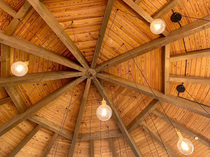 The cathedral wood ceiling and hanging lights wouldn
