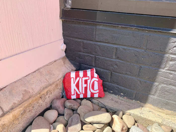 I especially liked the tiny details outside, like this painted KFC rock.