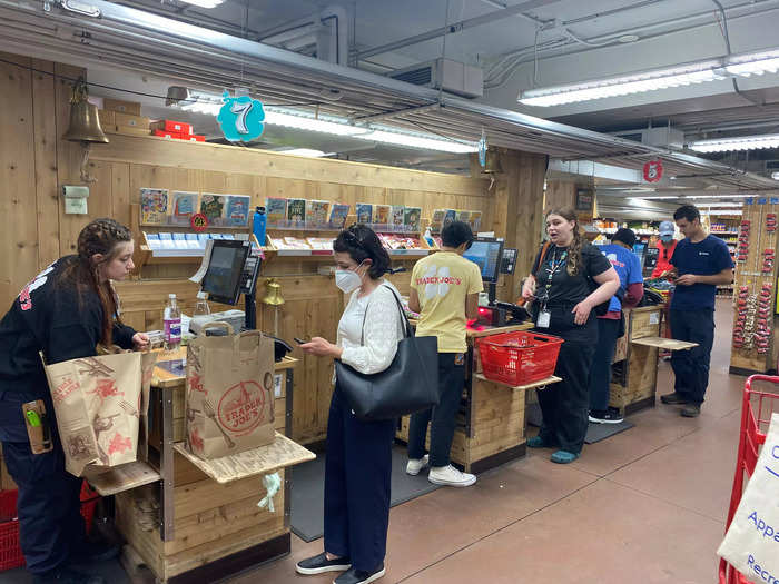 It leads to five different registers, and everyone had to wait for a cashier to call them over before they could check out.