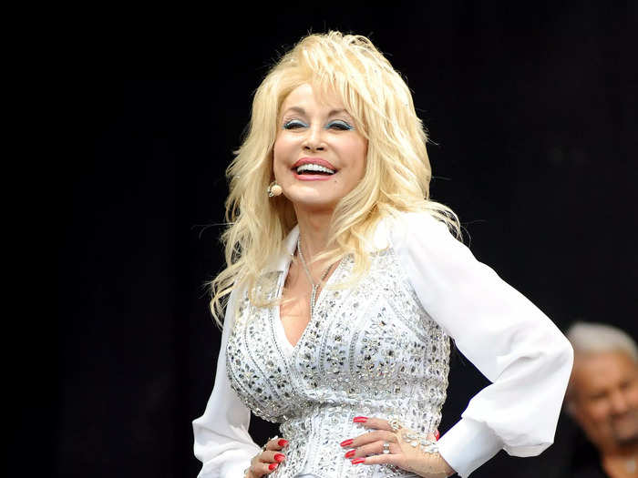 At the 2014 Glastonbury Festival, Dolly Parton wore a rhinestone-encrusted white pantsuit that seemed inspired by Elvis.