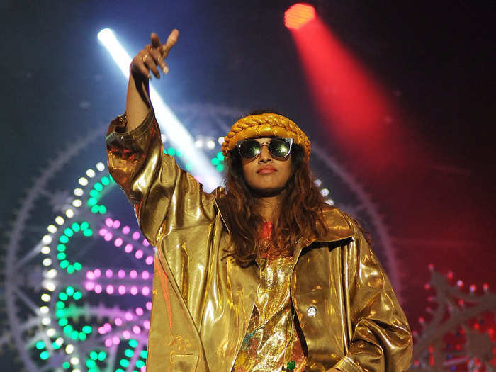 2014 headliner M.I.A. wore an entirely gold outfit with sunglasses and sneakers to perform.