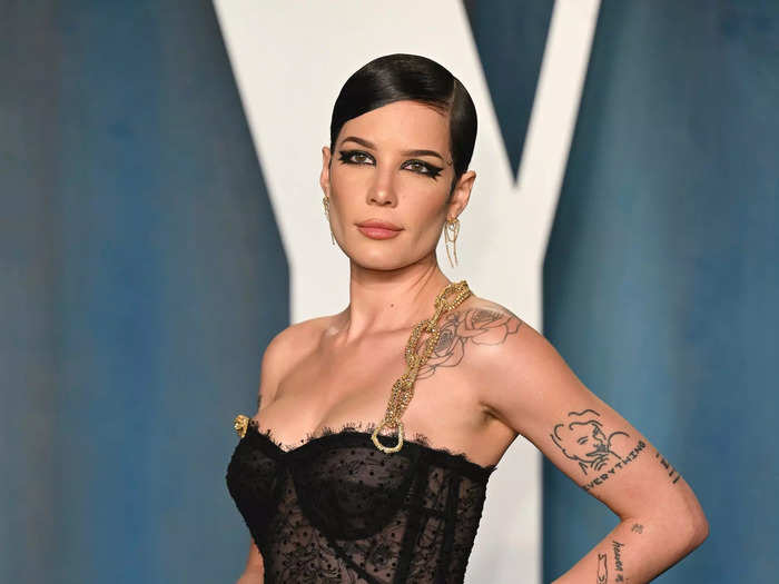 Halsey arrived at the 2022 Vanity Fair Oscar Party wearing a sheer black gown with bodice detailing.