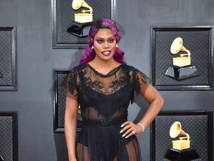 Laverne Cox arrived at the 2022 Grammys wearing a completely sheer lingerie-inspired archival look by John Galliano.