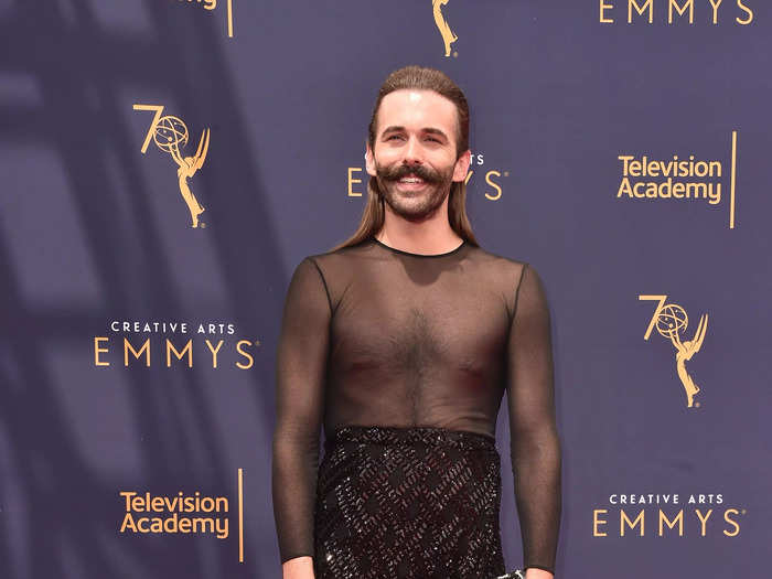 To the 2018 Creative Arts Emmys, "Queer Eye" star Jonathan Van Ness wore a dress with a mesh top with a sequined skirt with a thigh-high slit.