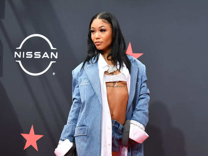 Coi Leray wore double denim as part of an oversized ensemble for the BET Awards.