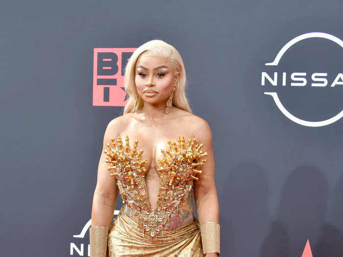 Blac Chyna had a golden moment in a bustier with chess pieces on it and a matching skirt with a train.