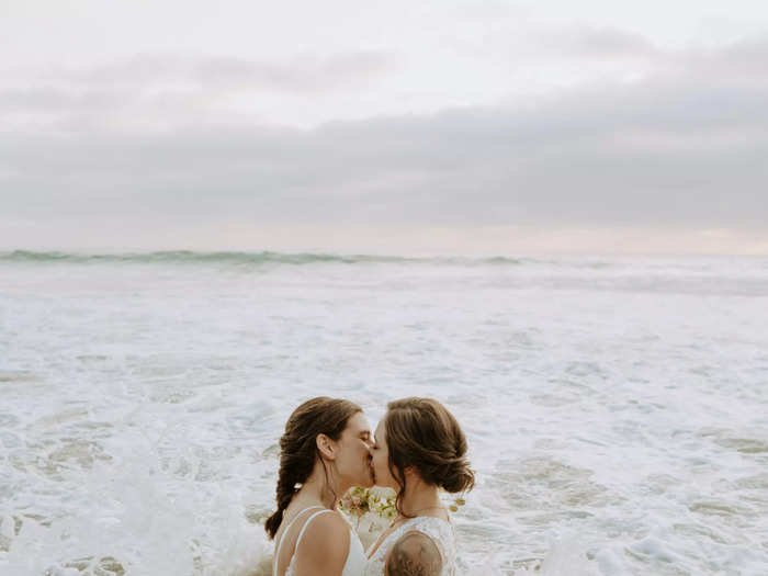 One couple chose to destroy their outfits in the ocean during their elopement shoot.