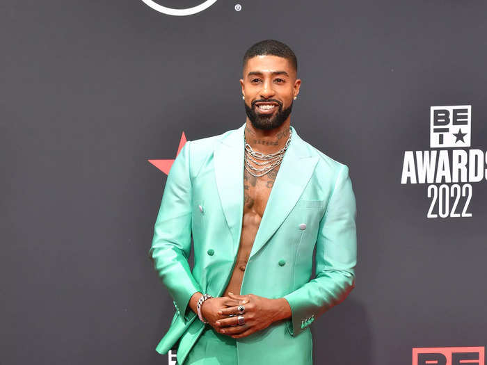 Skyh Alvester Black went shirtless in a two-tone aqua suit and metallic boots.