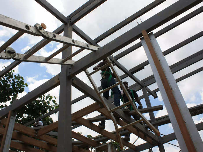 The materials were sawed and hoisted up with ladders to form the outer shell of the house.