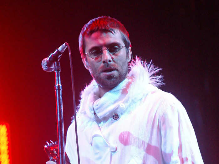 In 2004, Liam Gallagher continued his personal trend of performing in a parka jacket but with a white feathery twist.