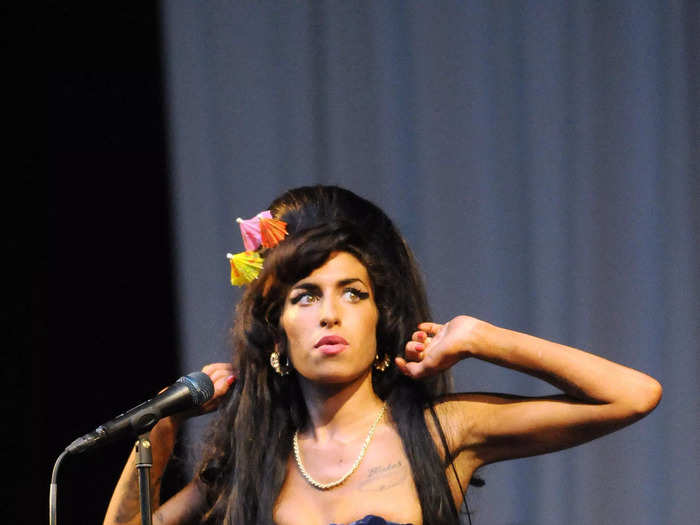 Amy Winehouse became known for her fun minidresses, including the blue sequinned one she wore to perform in 2008.