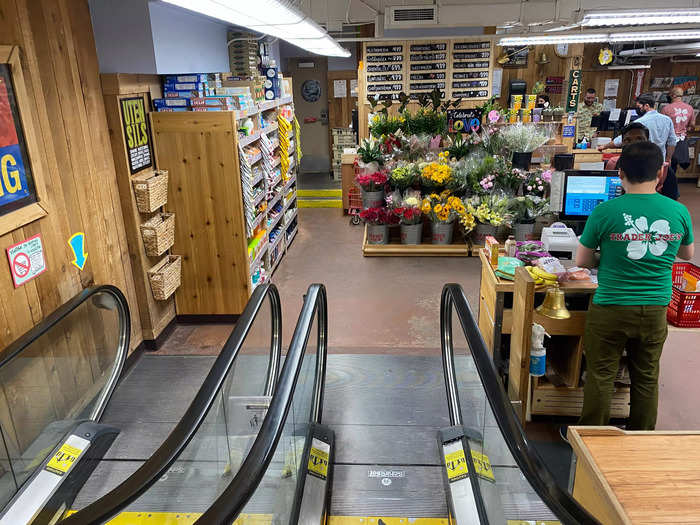 The flower section was directly in front of me as I stepped off the escalator, and a line of registers was to my right.