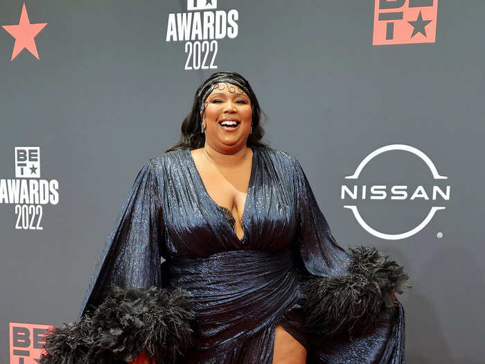 Lizzo went for a dramatic look at the 2022 awards show in a navy gown.