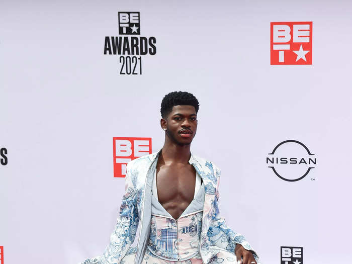 Lil Nas X embraced the no-shirt trend in this blue-and-white, three-piece suit at the 2021 awards show.