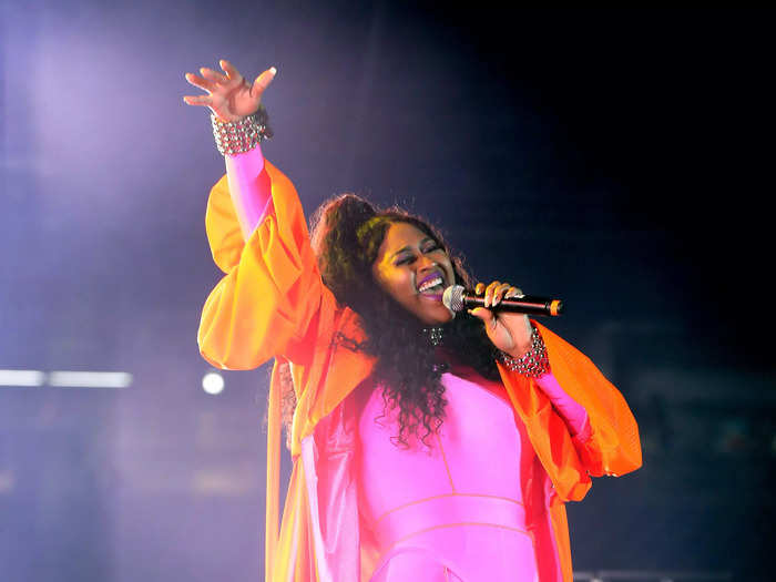 Jazmine Sullivan belted it out in a bright pink jumpsuit and orange cape coat.