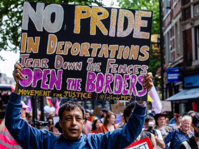 Meanwhile, a Movement For Justice activist held a sign that advocated for immigration rights.