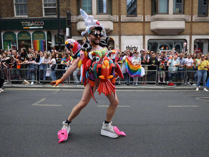 Another person marched in a colorful costume which consisted of inflatable parrots.