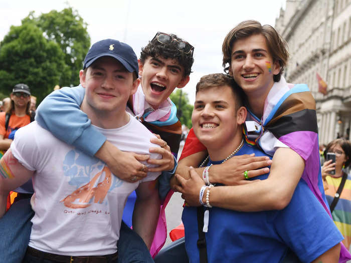 The cast of "Heartstopper" surprised the crowds by marching behind the giant flag.