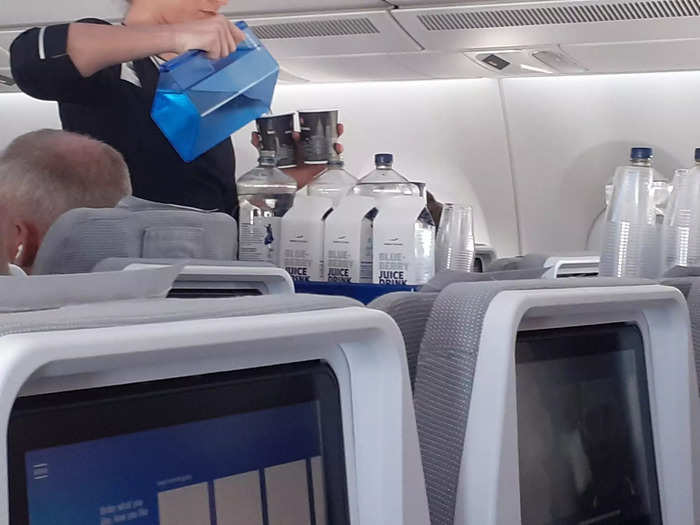 About halfway through the flight, the flight attendants came through offering drinks.