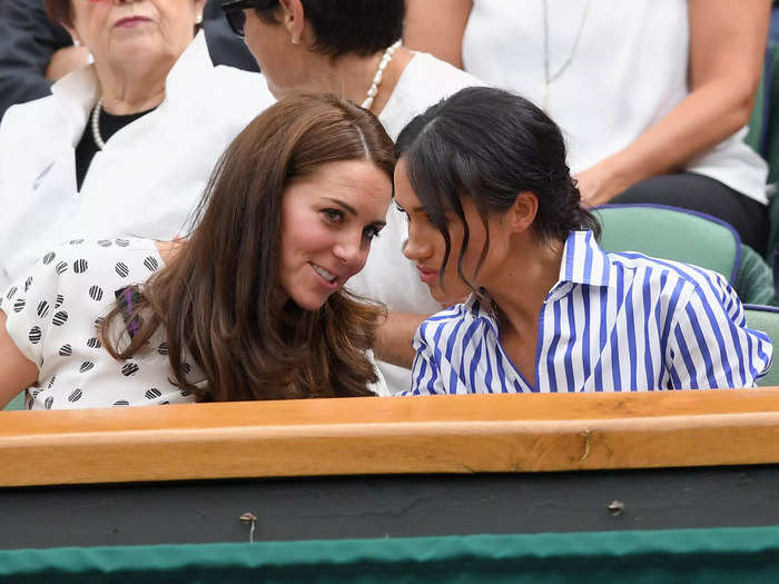 Meghan Markle made her royal debut alongside Middleton, a Wimbledon veteran, in 2018. Here, the Duchess of Cambridge appears to whisper in her ear.