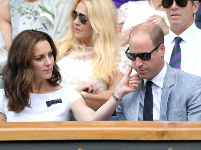 In a cute couples moment, the Duchess of Cambridge appears to wipe away at something on William