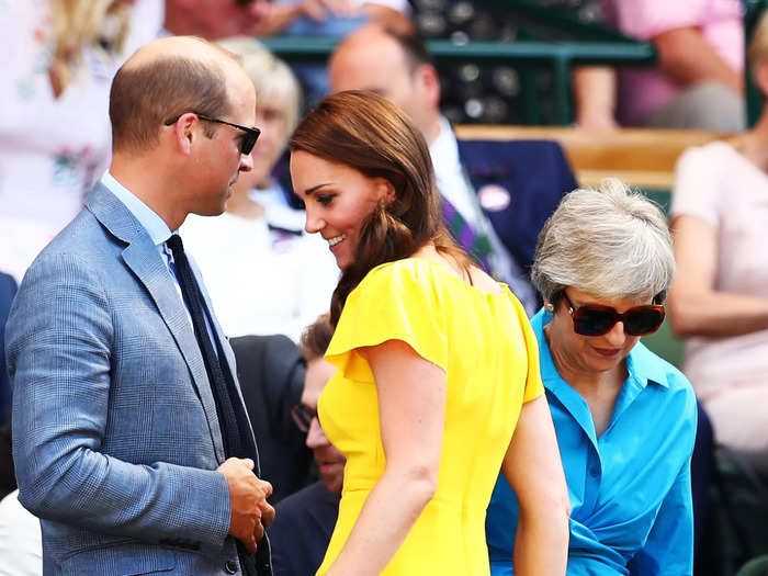 Middleton appeared to squeeze by her husband as they found seats alongside former British Prime Minister Theresa May at Wimbledon 2018.