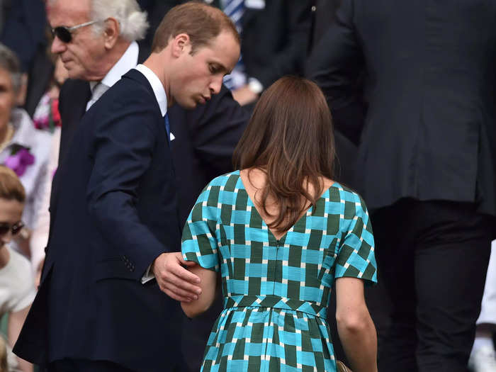 In a rare moment, William guided Middleton up the stands by holding her arm.