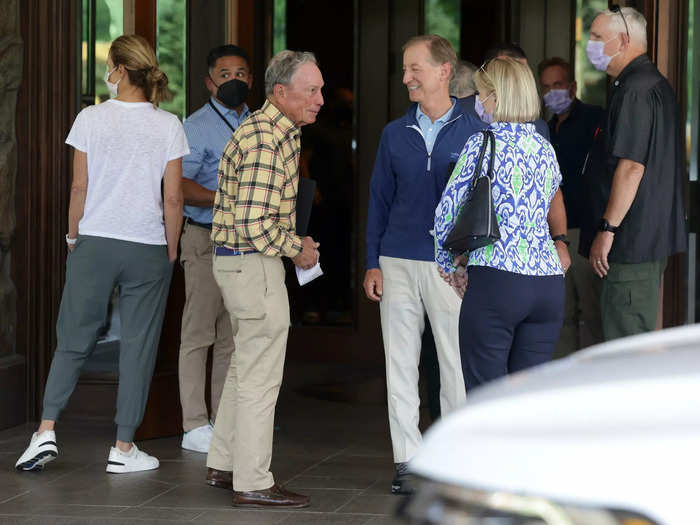 Former New York City Mayor Michael Bloomberg greets a few fellow attendees outside the lodge.