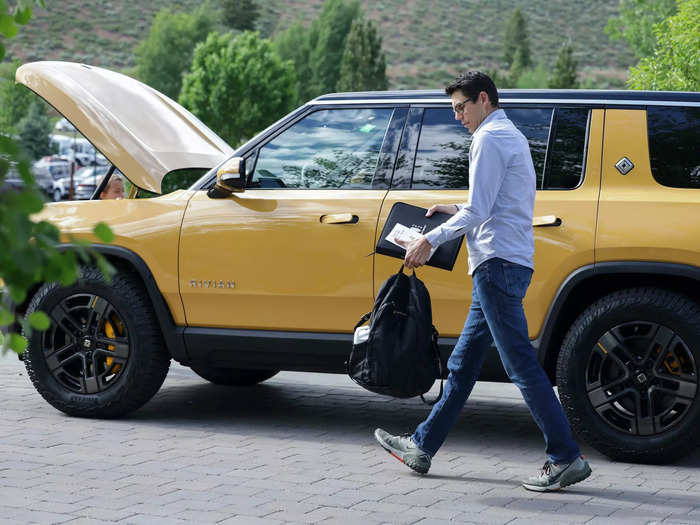 RJ Scaringe, CEO of carmaker Rivian, arrives in one of his company