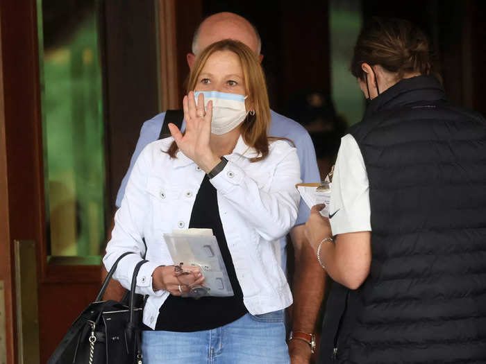 GM chief executive Mary Barra waves while checking in at Sun Valley Lodge.