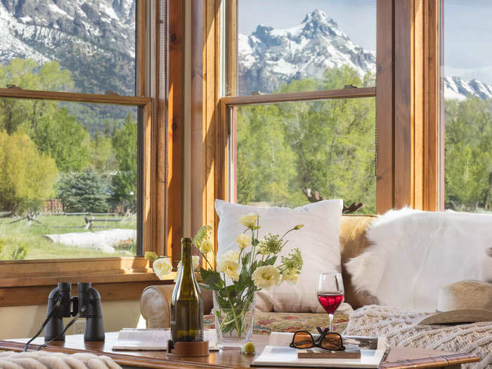 After work, kick back on the couch and enjoy some wine — this time, taking in those mountain views.