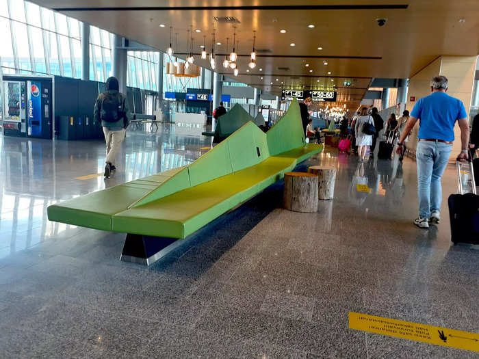 Seating is shown that mimics the shape of graphic green hills.