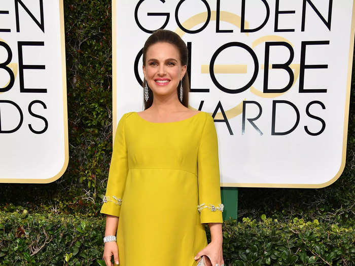 12. The actress went for a bright retro look in a vintage, empire-waist gown in mustard at the 2017 Golden Globes.