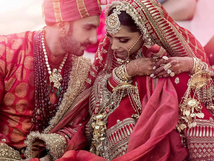 Actress Deepika Padukone wore a vibrant red and gold Sabyasachi lehenga, a stitched dress often worn at weddings. Her groom, Ranveer Singh wore a red raw silk sherwani, also by Sabyasachi.