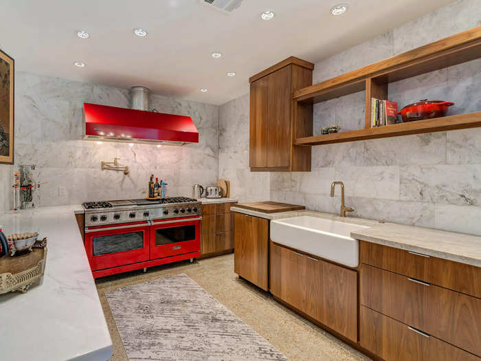 The kitchen comes with double Viking ovens, custom wood cabinetry, and a farmhouse sink.