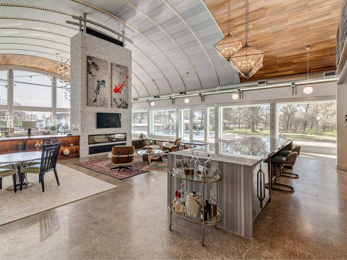 The main living space of the Quonset home has an open-concept layout, with polished concrete floors and a barreled ceiling.