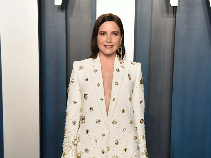 Bush went for a unique look at the 2020 Vanity Fair Oscar Party in this over-sized white suit covered in gold and pearl accents and hot-pink silk.