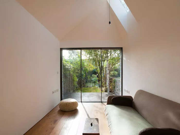 Down the hallway from the kitchen is the minimalistic reception room, a geometric space that Reynolds said was finished by local company Adam Lloyd Construction.