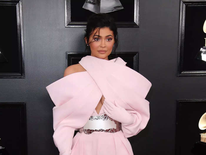 Kylie Jenner wore an excess of pink with giant statement gloves to attend the 2019 Grammy Awards.