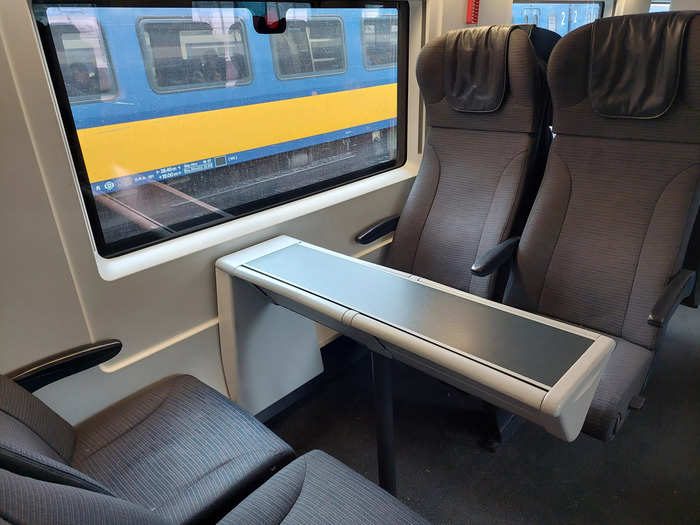 A few seats in each carriage were arranged in fours around a small table, although each passenger could extend the table out a little.